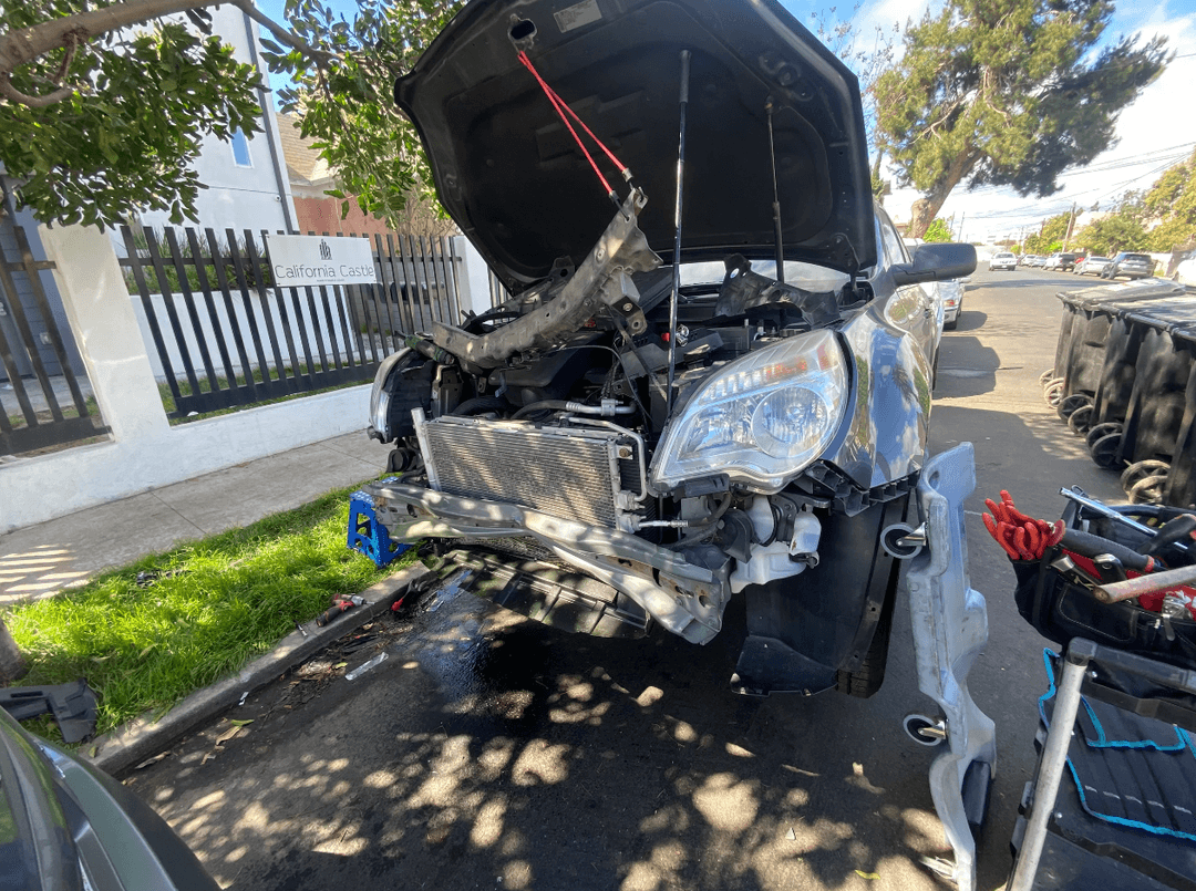 picture of a car that is about to be fixed by a mechanic