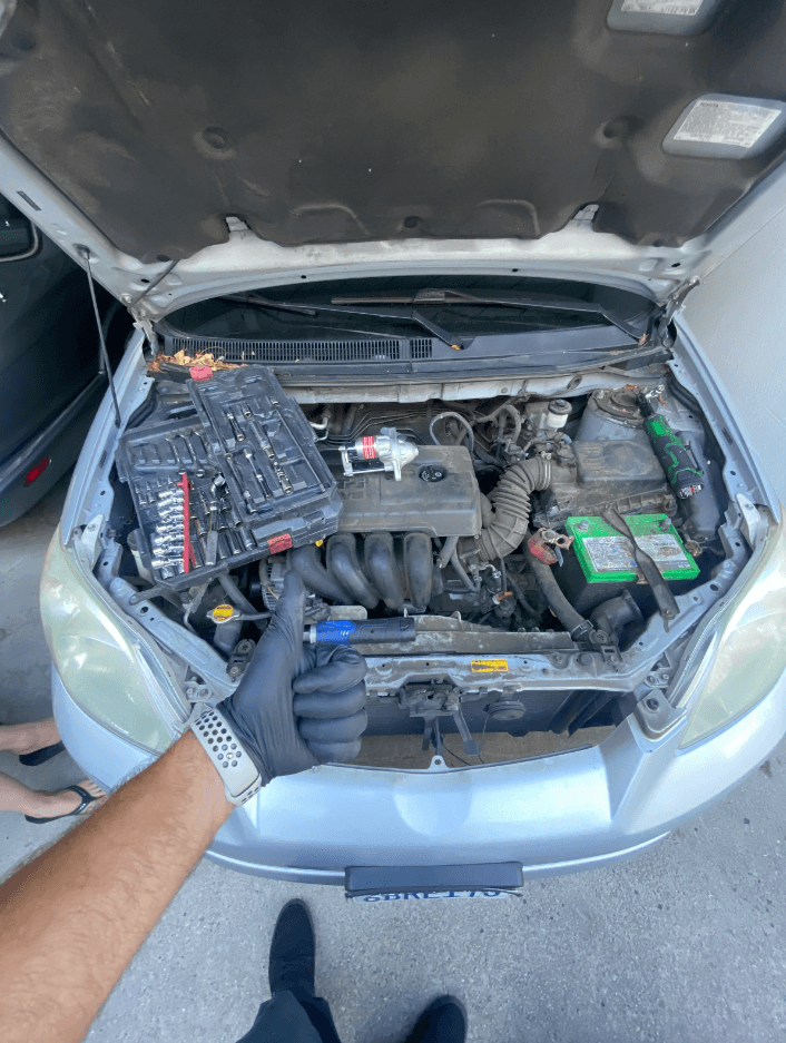 Mechanic doing maintenance service on a car